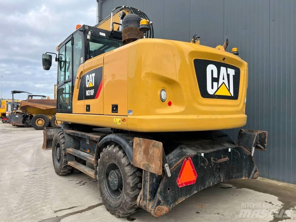 CAT M318F Gumikerekes kotrók
