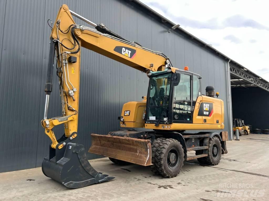 CAT M318F Gumikerekes kotrók