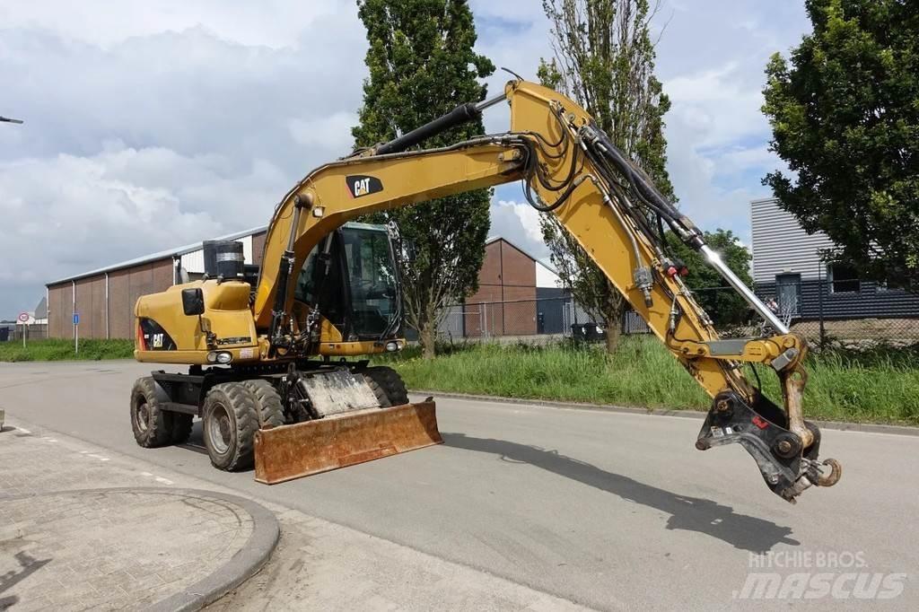 CAT M313 D Gumikerekes kotrók