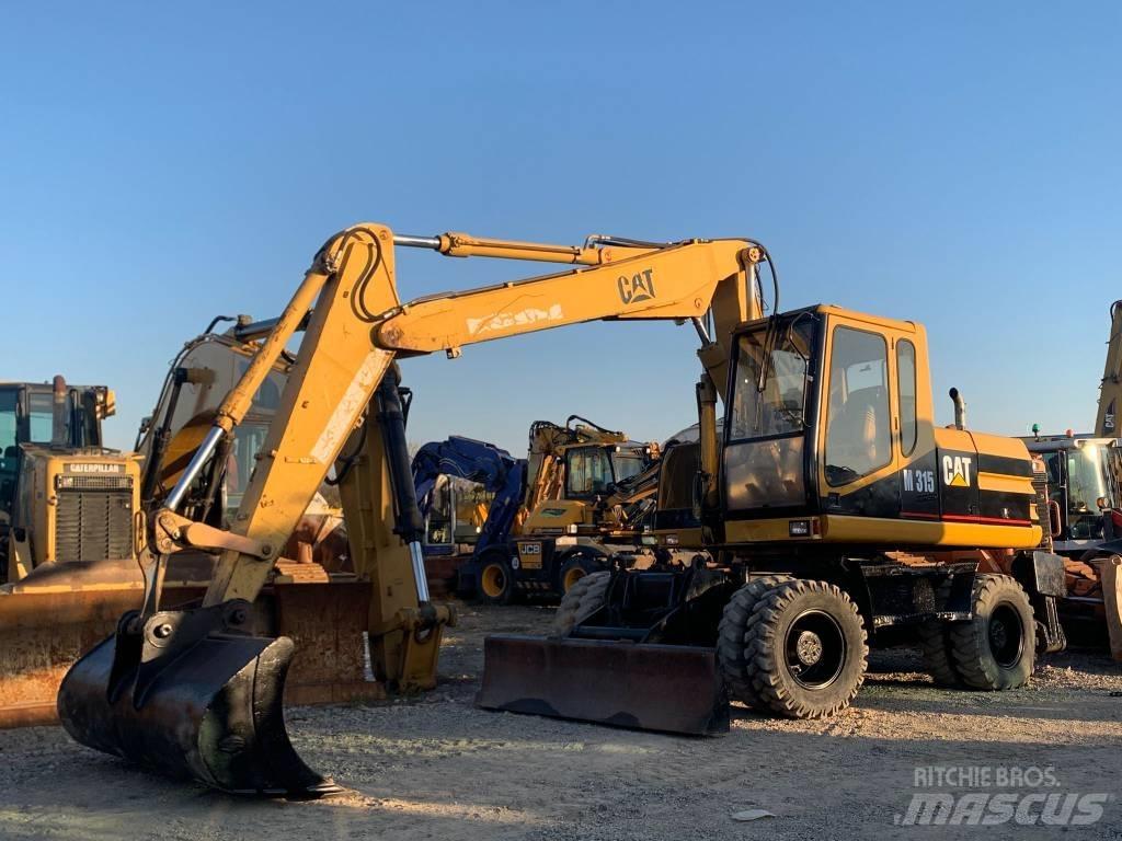 CAT M 315 Gumikerekes kotrók