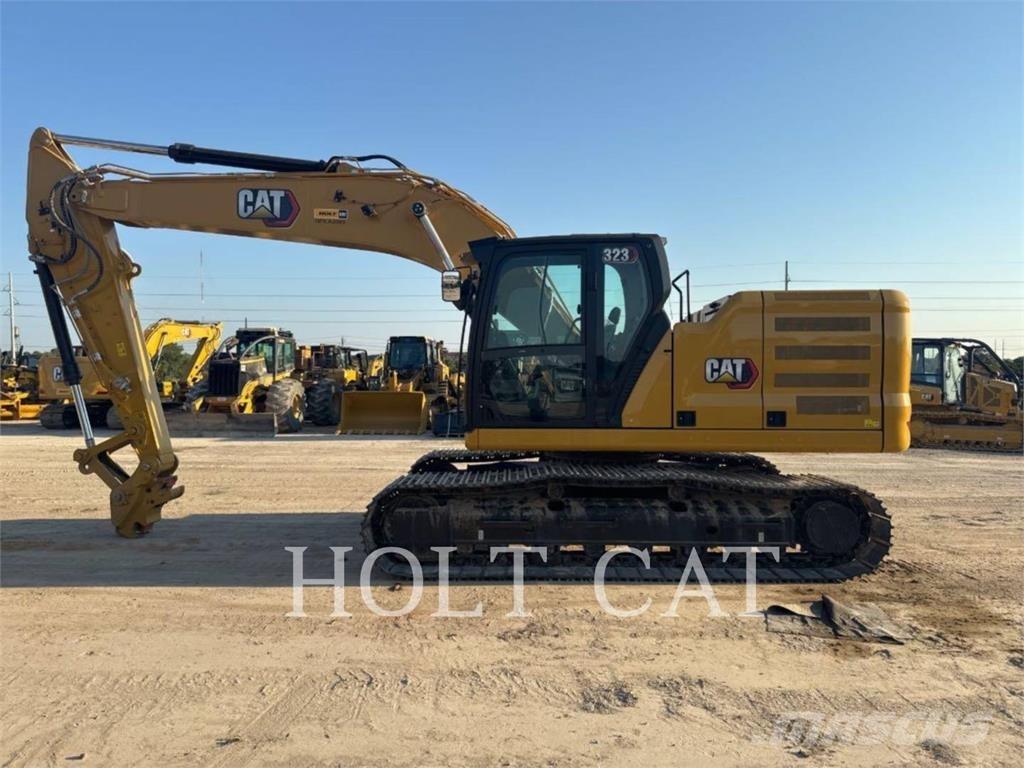 CAT 323 TC Gumikerekes homlokrakodók