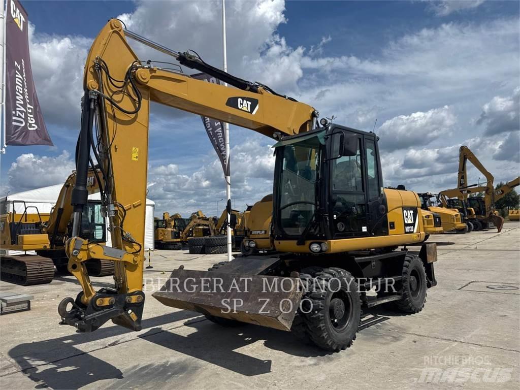 CAT M313D Gumikerekes kotrók