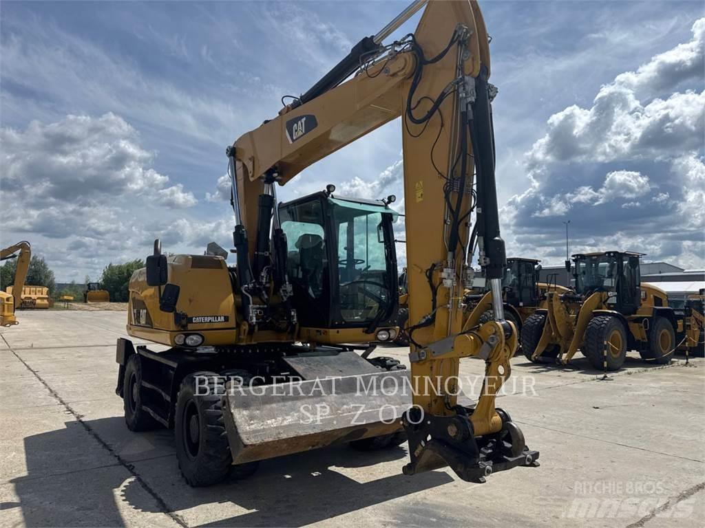 CAT M313D Gumikerekes kotrók