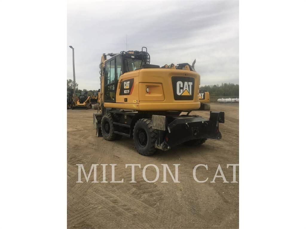CAT M317F Gumikerekes kotrók