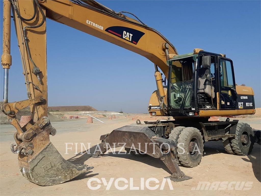 CAT M318 Gumikerekes kotrók