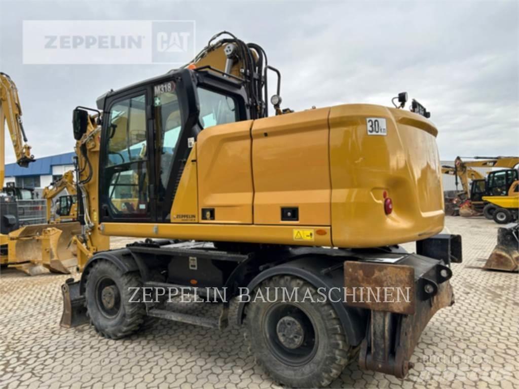 CAT M318-07A Gumikerekes kotrók