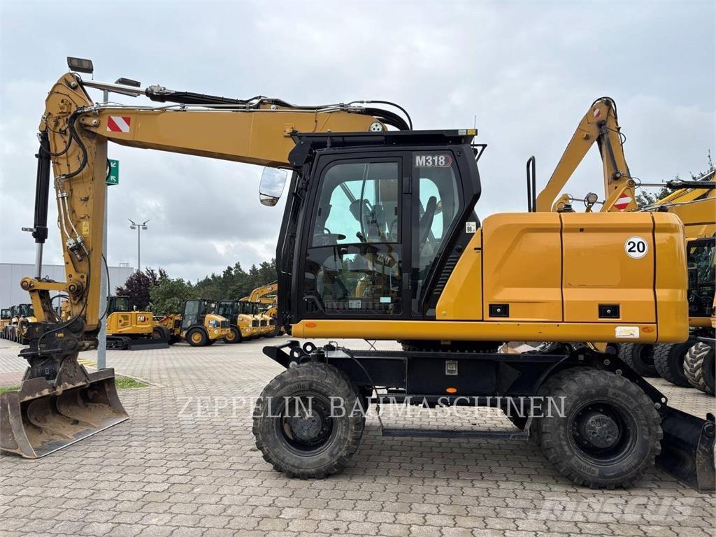 CAT M318-07A Gumikerekes kotrók