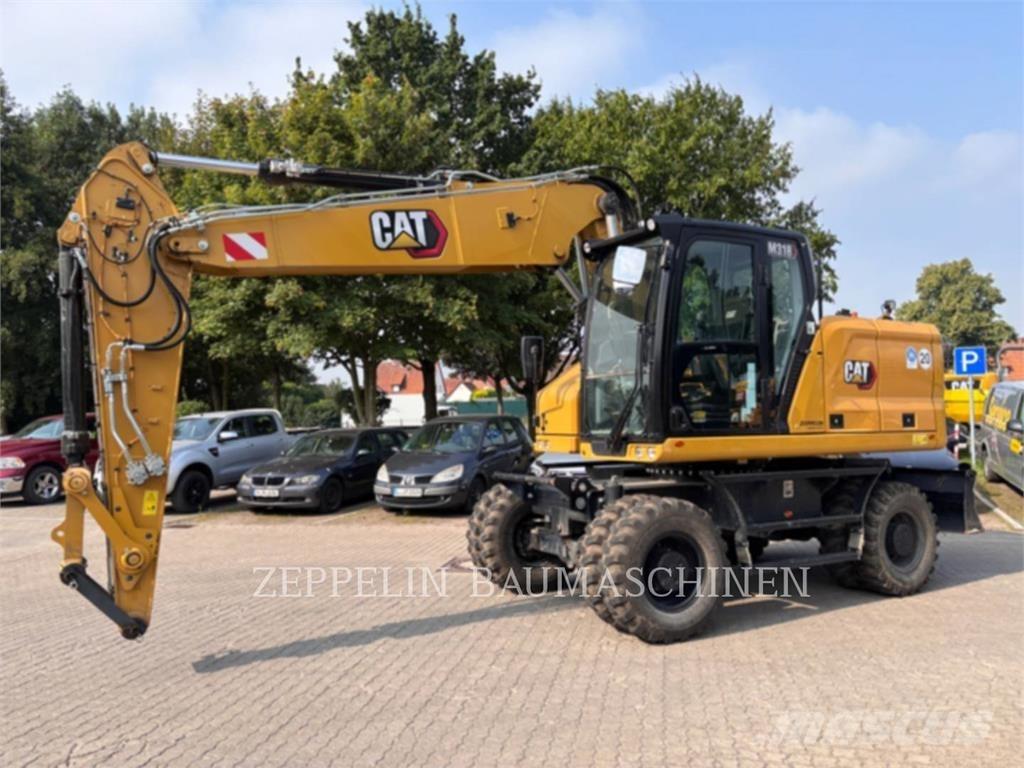 CAT M318-07A Gumikerekes kotrók
