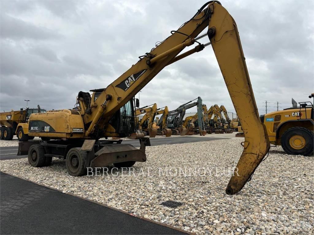 CAT M318C Gumikerekes kotrók