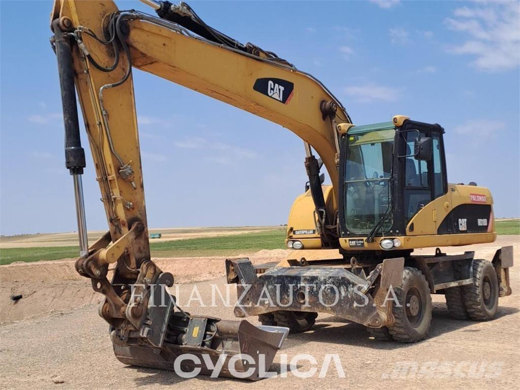 CAT M318D Gumikerekes kotrók