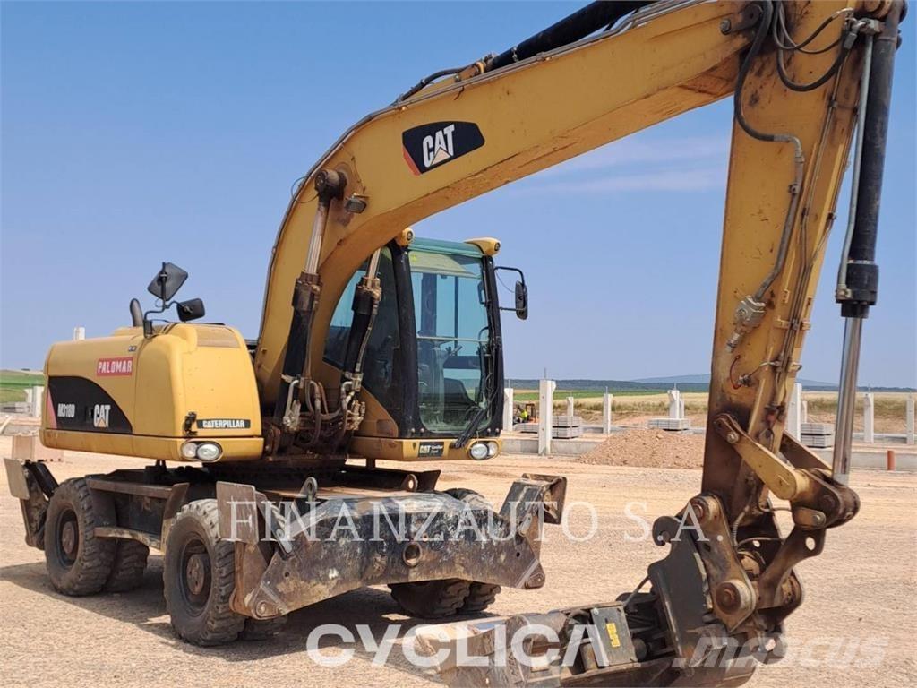 CAT M318D Gumikerekes kotrók