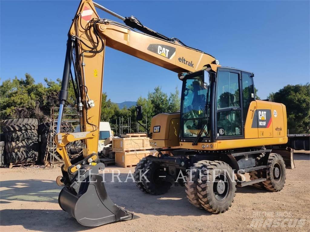 CAT M318F Gumikerekes kotrók