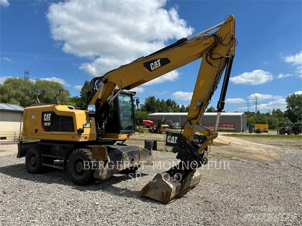 CAT M318F Gumikerekes kotrók