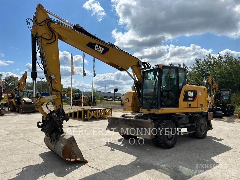 CAT M318F Gumikerekes kotrók