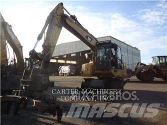 CAT M318F Gumikerekes kotrók