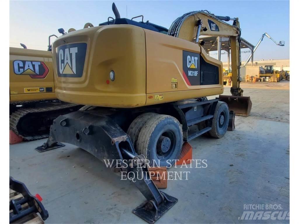 CAT M318F Gumikerekes kotrók
