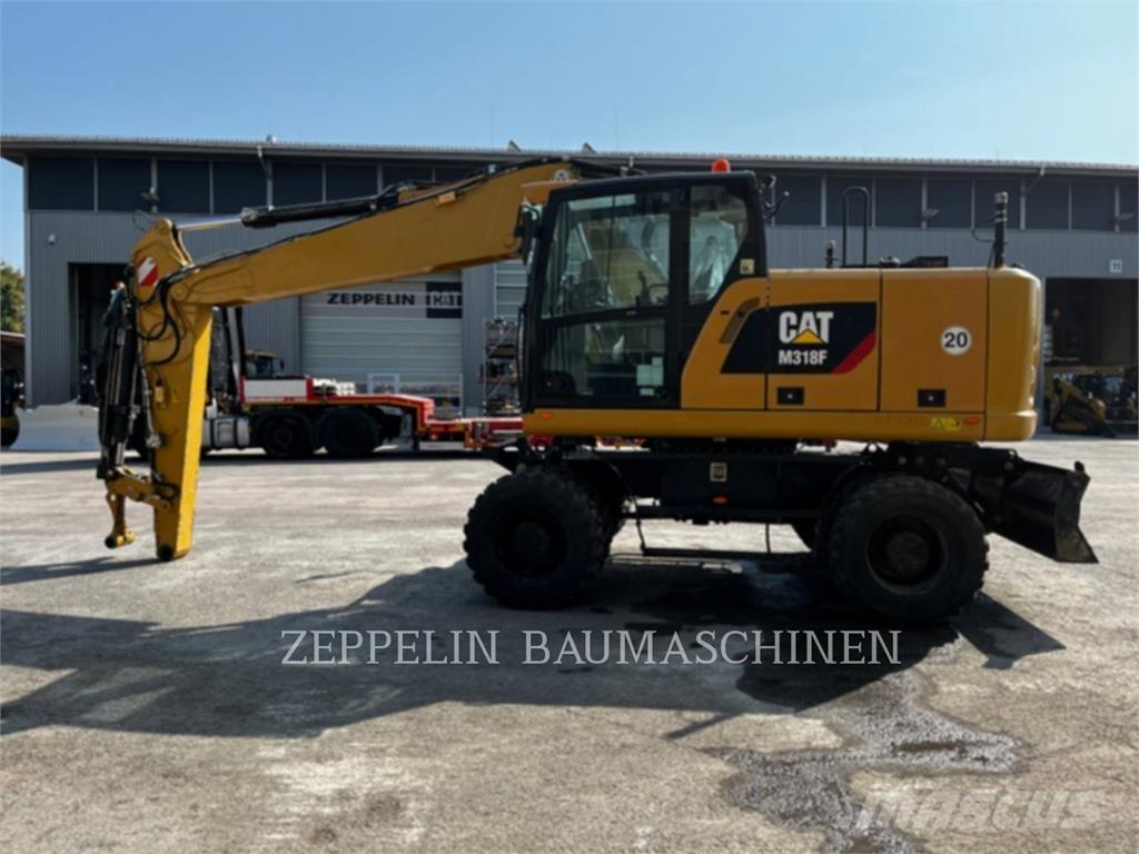 CAT M318F Gumikerekes kotrók