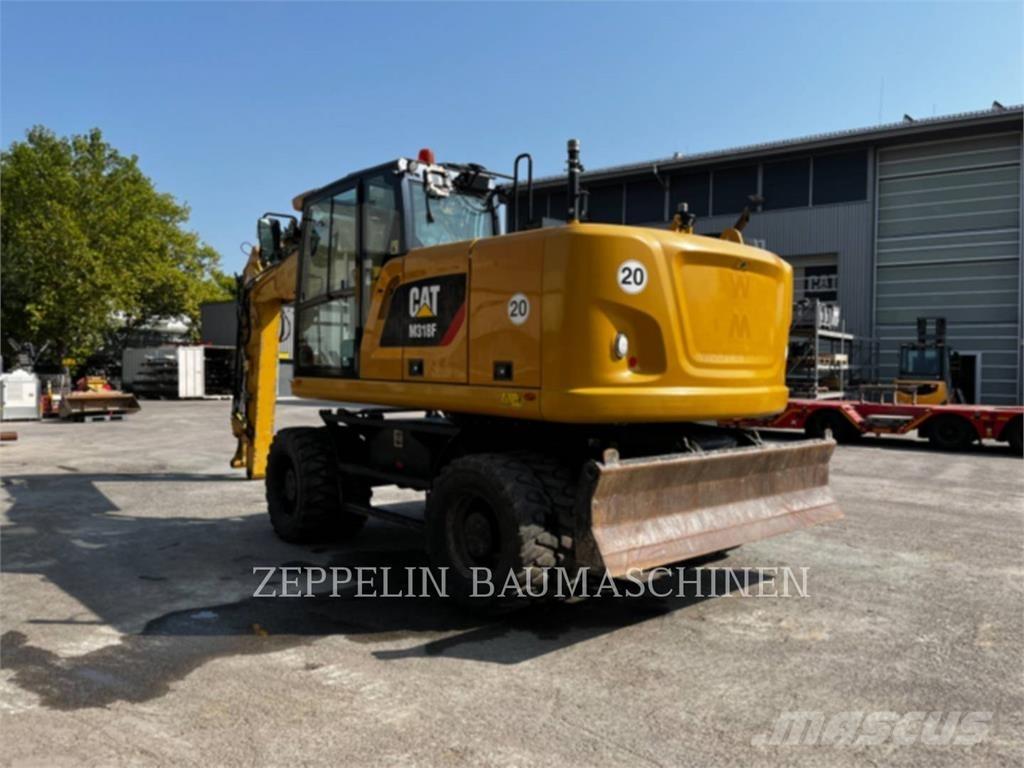 CAT M318F Gumikerekes kotrók