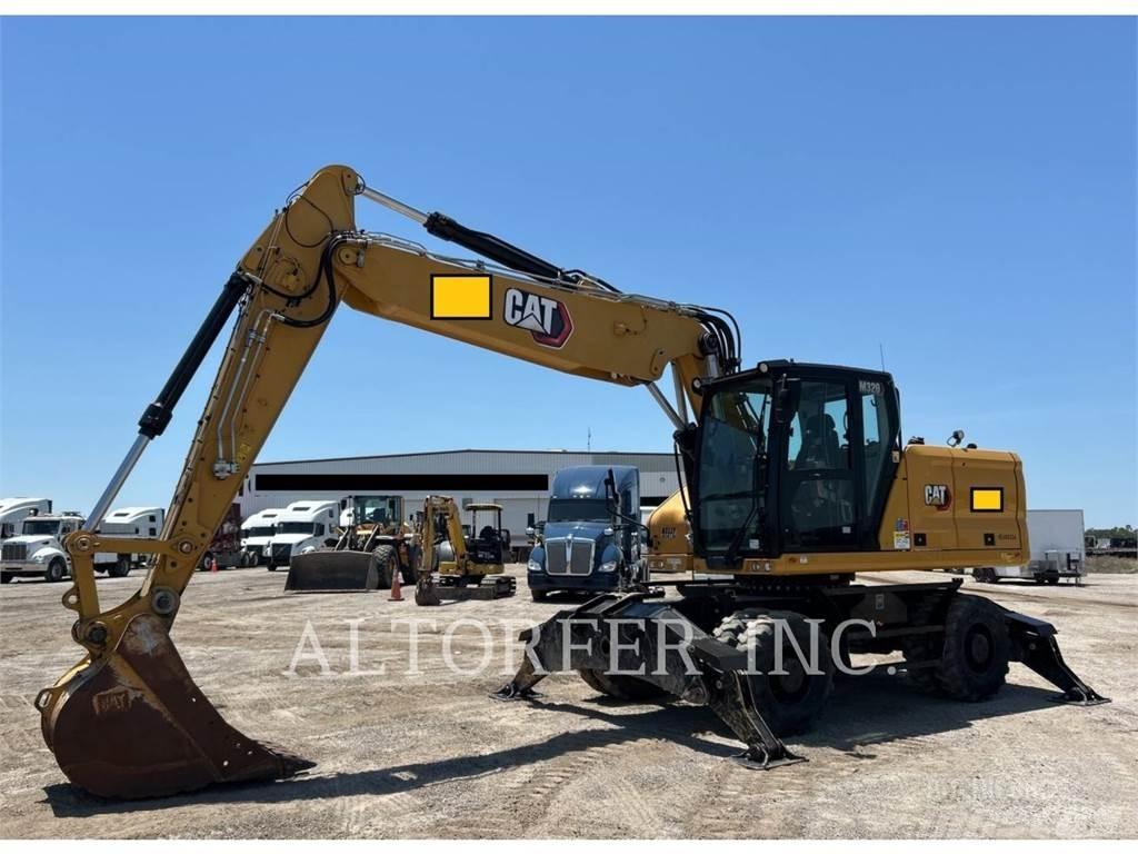 CAT M320 Gumikerekes kotrók