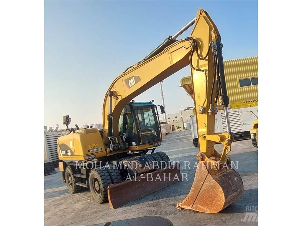 CAT M320D2 Gumikerekes kotrók