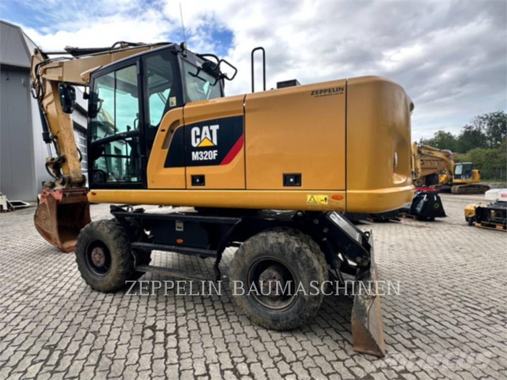CAT M320F Gumikerekes kotrók