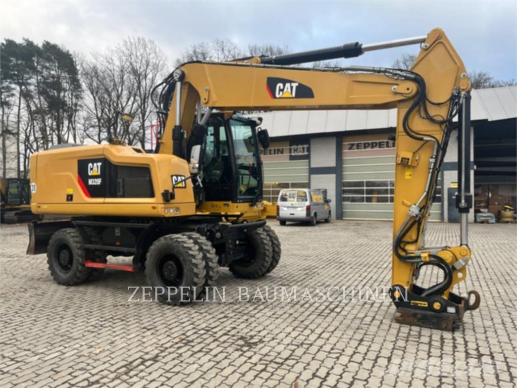 CAT M320F Gumikerekes kotrók