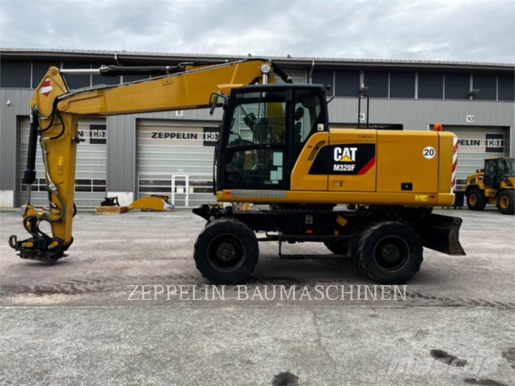 CAT M320F Gumikerekes kotrók