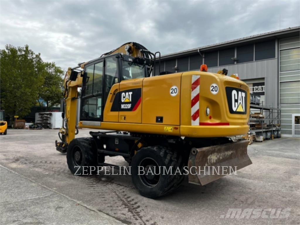 CAT M320F Gumikerekes kotrók