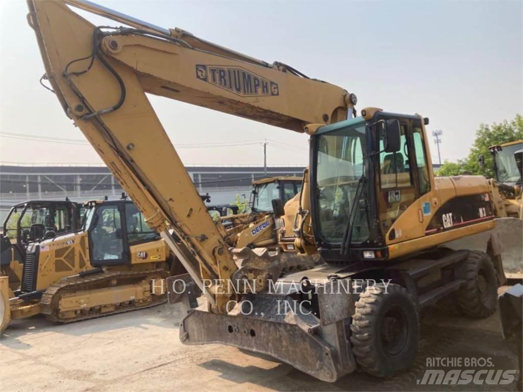 CAT M322C Gumikerekes kotrók