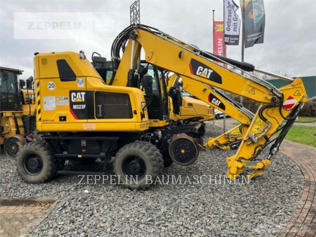 CAT M323F Gumikerekes kotrók
