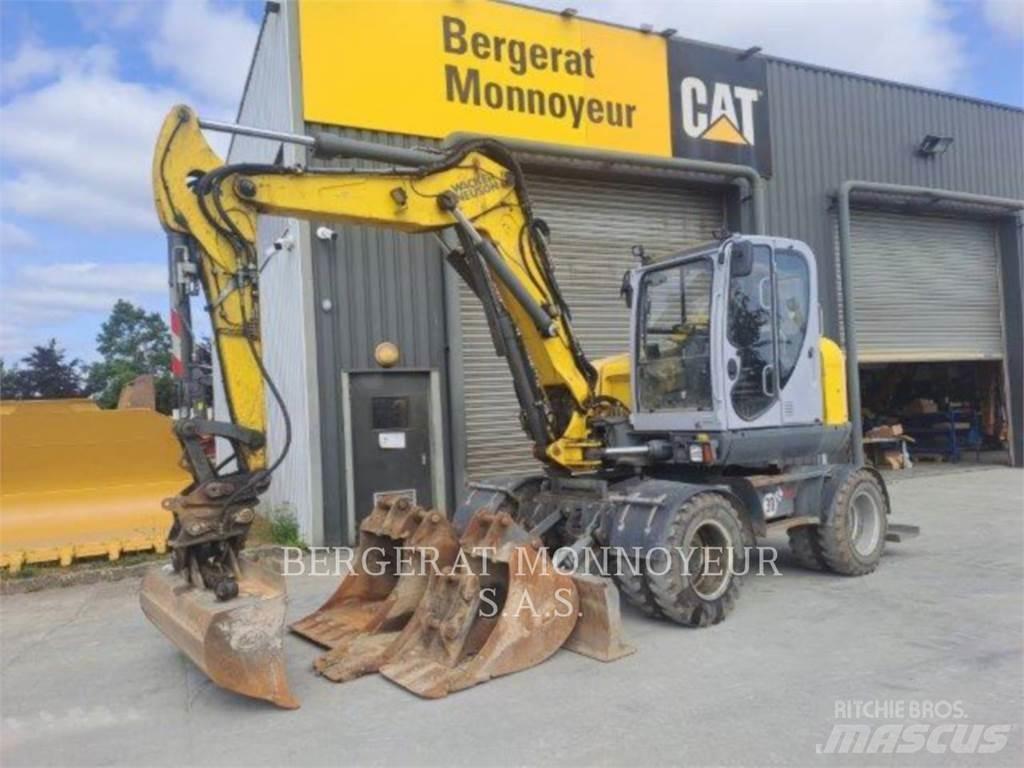 Neuson EW100 Gumikerekes kotrók