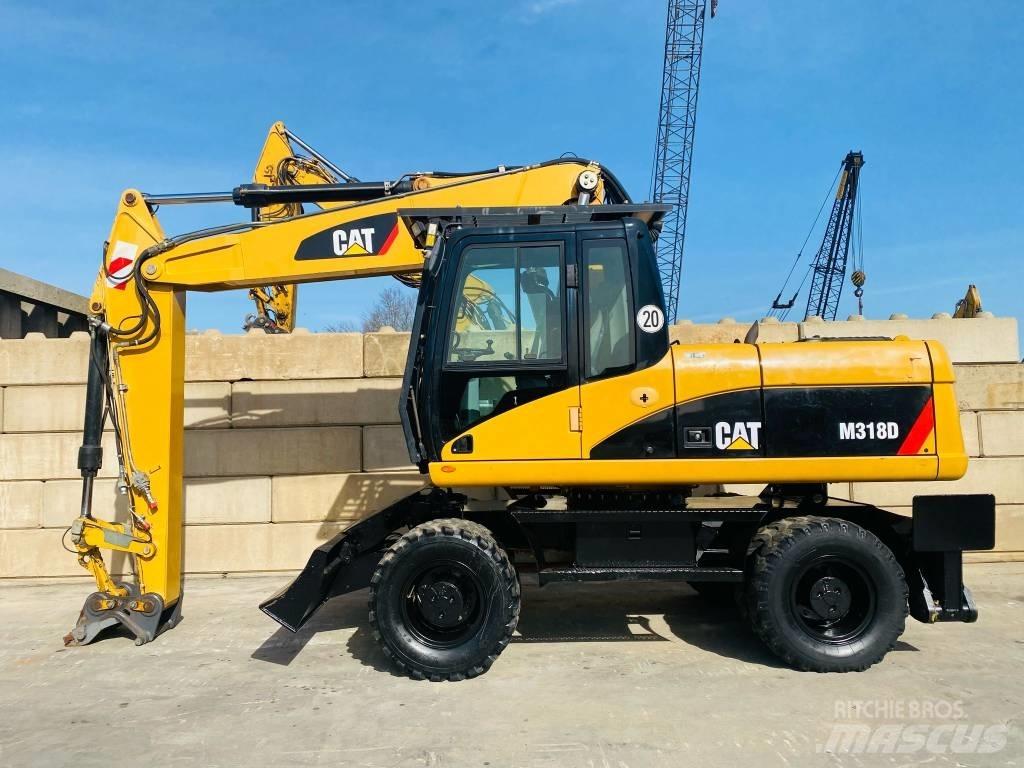 CAT M 318 D Gumikerekes kotrók