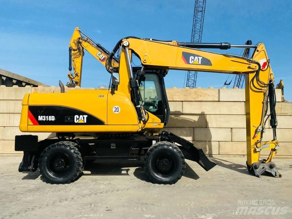 CAT M 318 D Gumikerekes kotrók