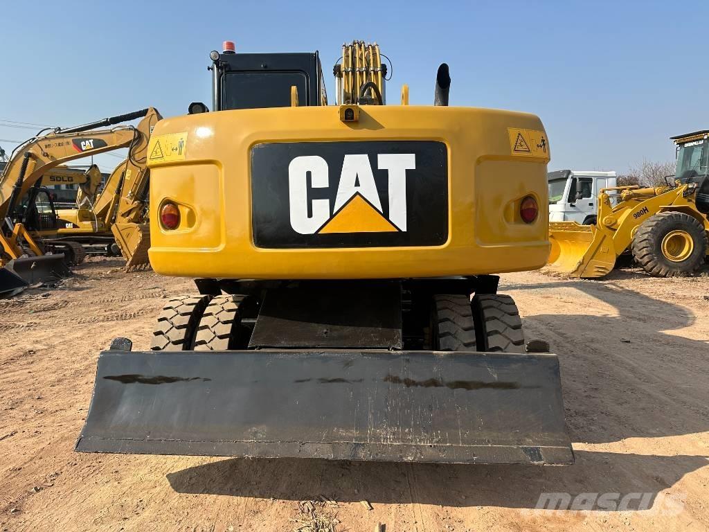 CAT M 320D Gumikerekes kotrók