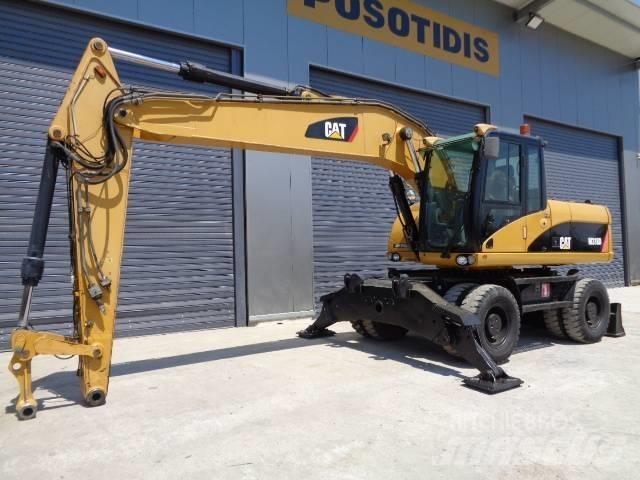 CAT M 318 D Gumikerekes kotrók