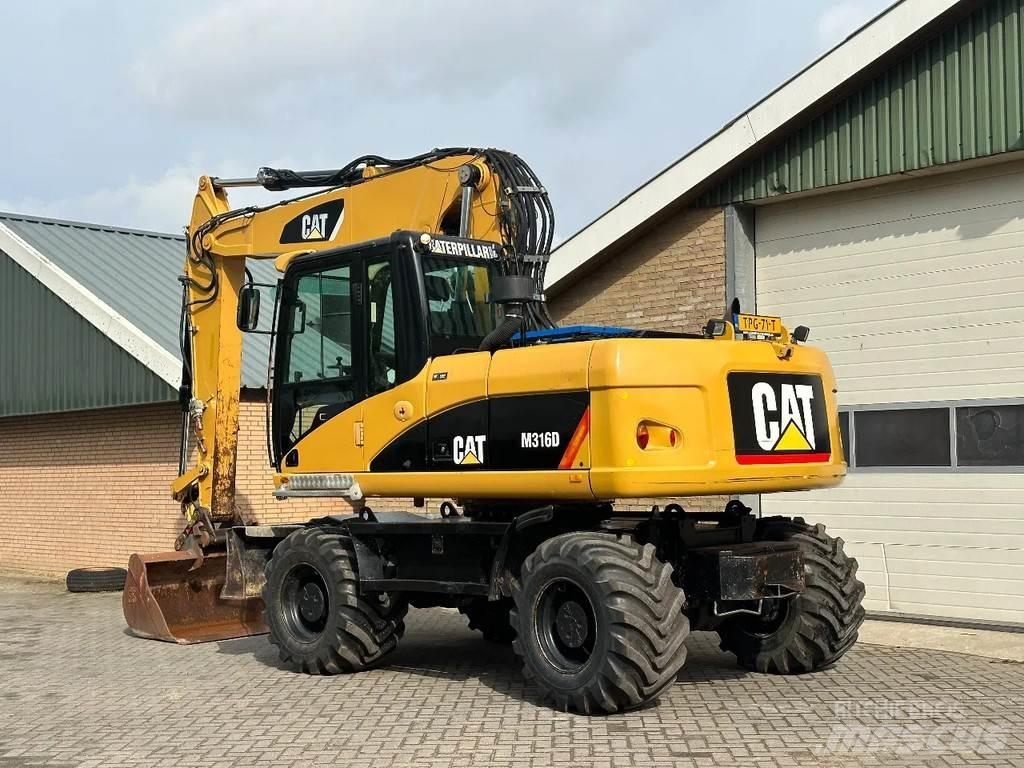 CAT M316D Gumikerekes kotrók