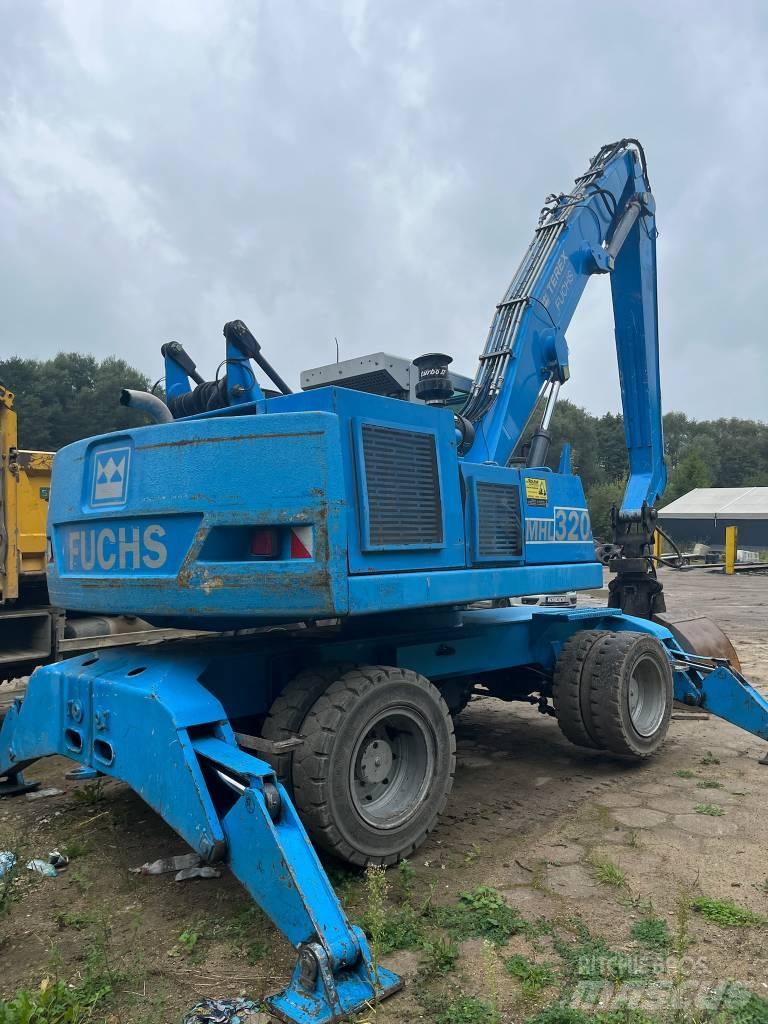 Fuchs MHL 320 Gumikerekes kotrók