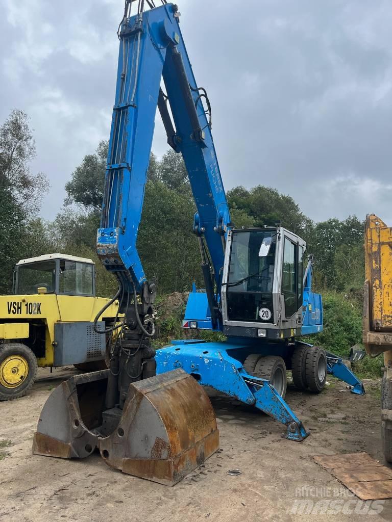 Fuchs MHL 320 Gumikerekes kotrók