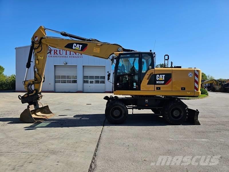 CAT M 320F Gumikerekes kotrók