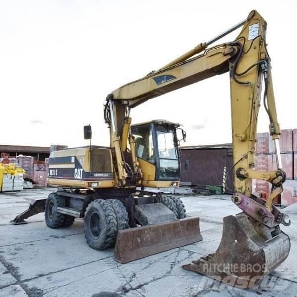 CAT M 315 Gumikerekes kotrók