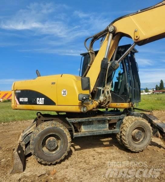 CAT M318 D Gumikerekes kotrók
