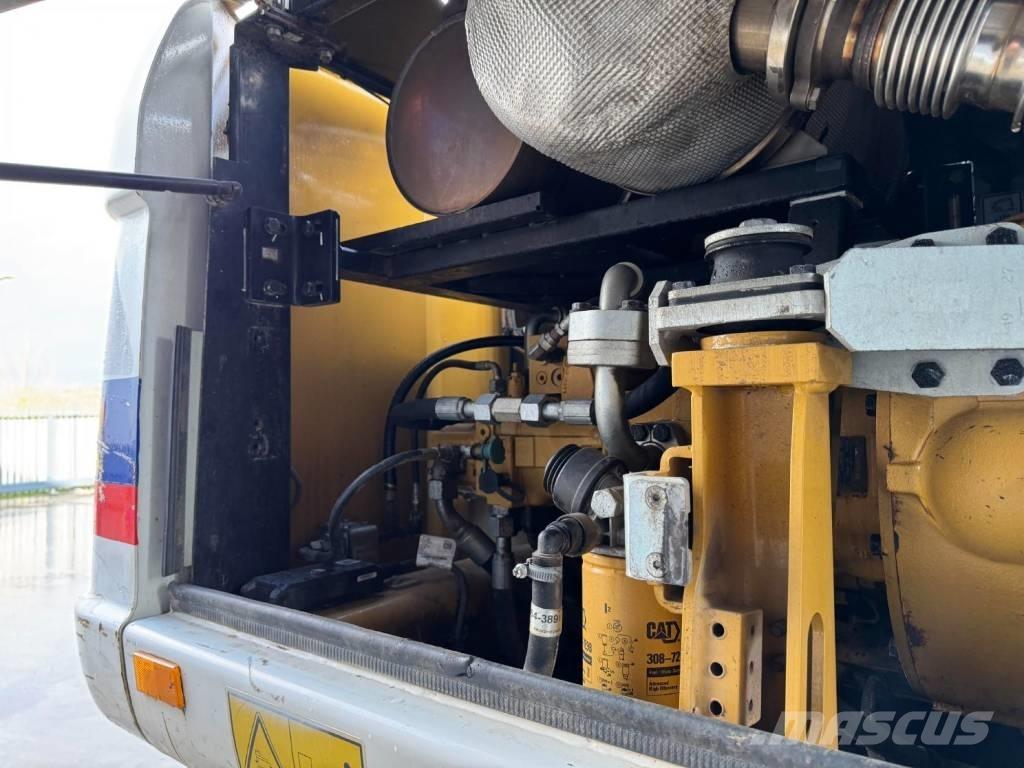 CAT M315D Gumikerekes kotrók