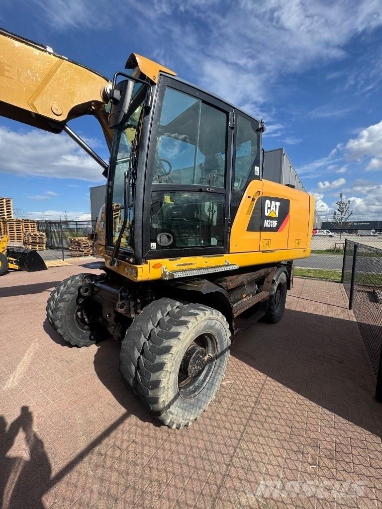 CAT 318 Gumikerekes kotrók