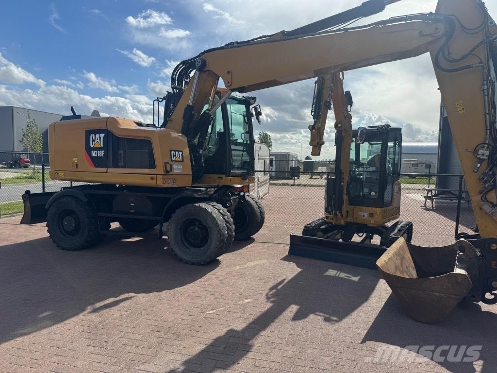CAT 318 Gumikerekes kotrók