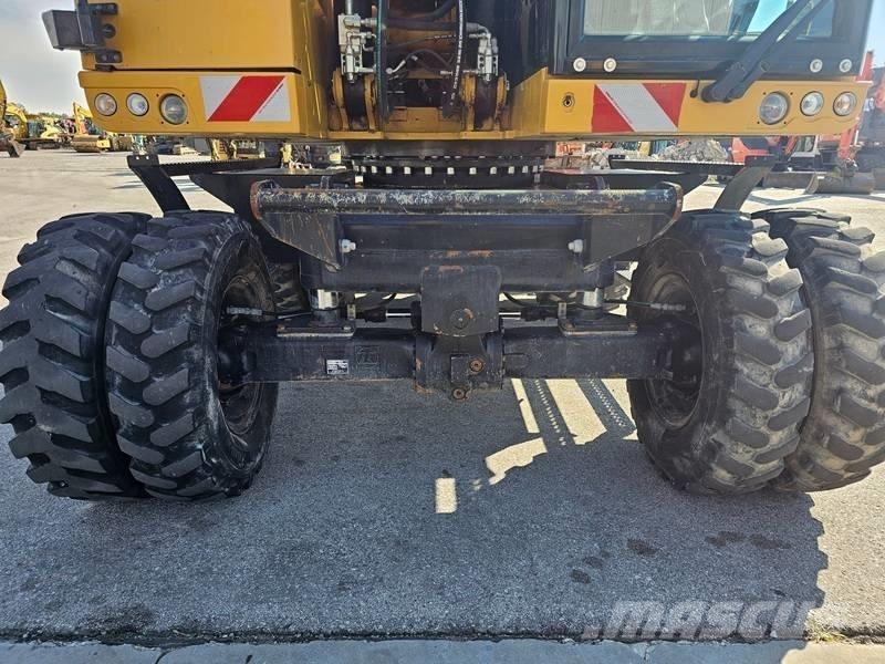CAT M320F Gumikerekes kotrók