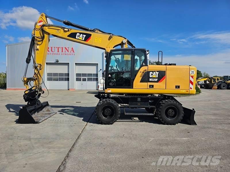 CAT M320F Gumikerekes kotrók