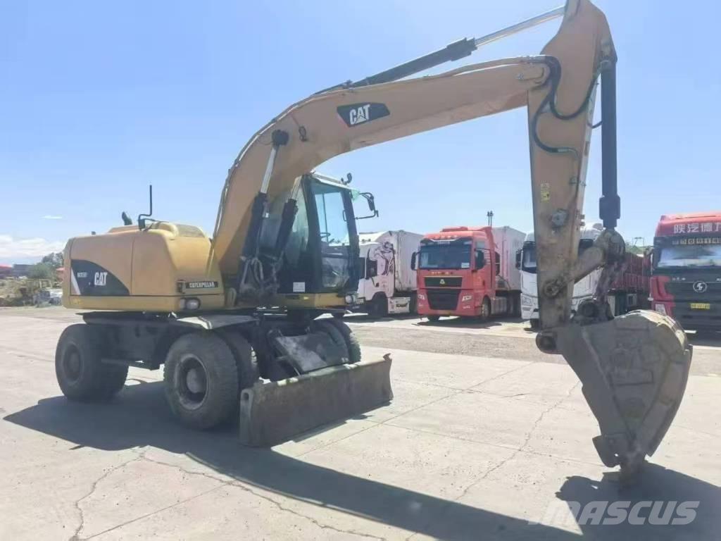 CAT M315D2 Gumikerekes kotrók