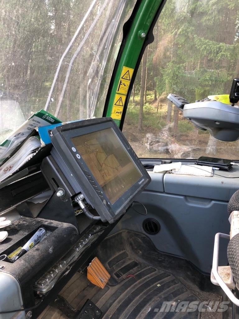 John Deere 810 E Kihordók