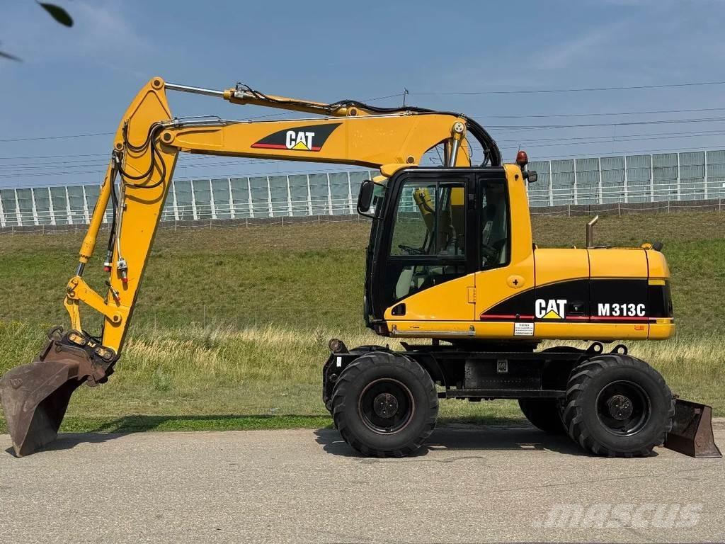 CAT M313C Gumikerekes kotrók