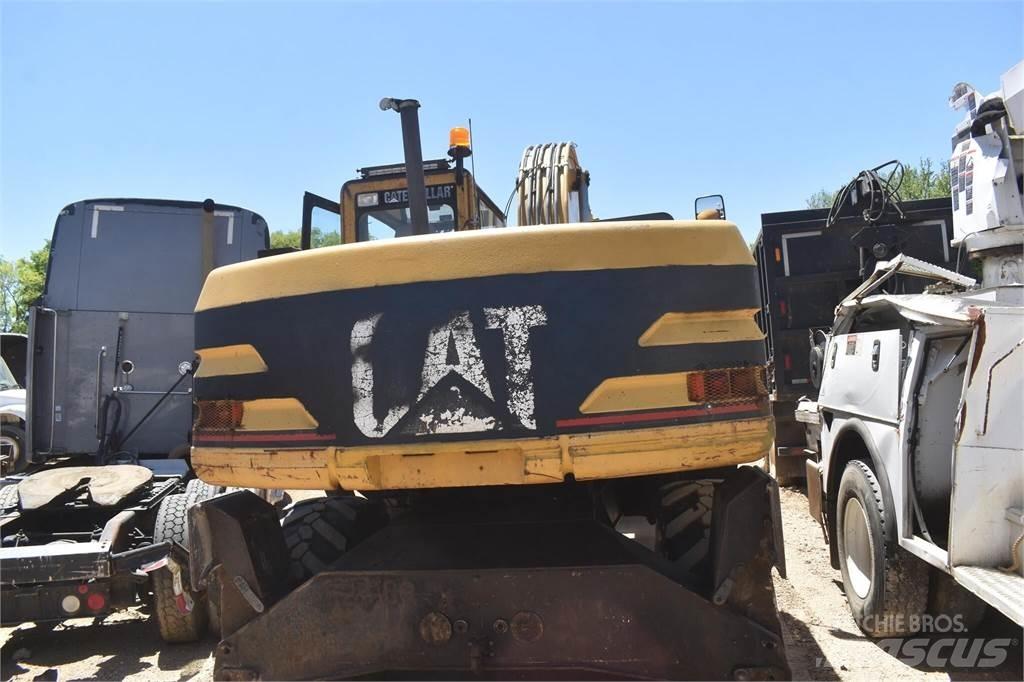 CAT M318 Gumikerekes kotrók